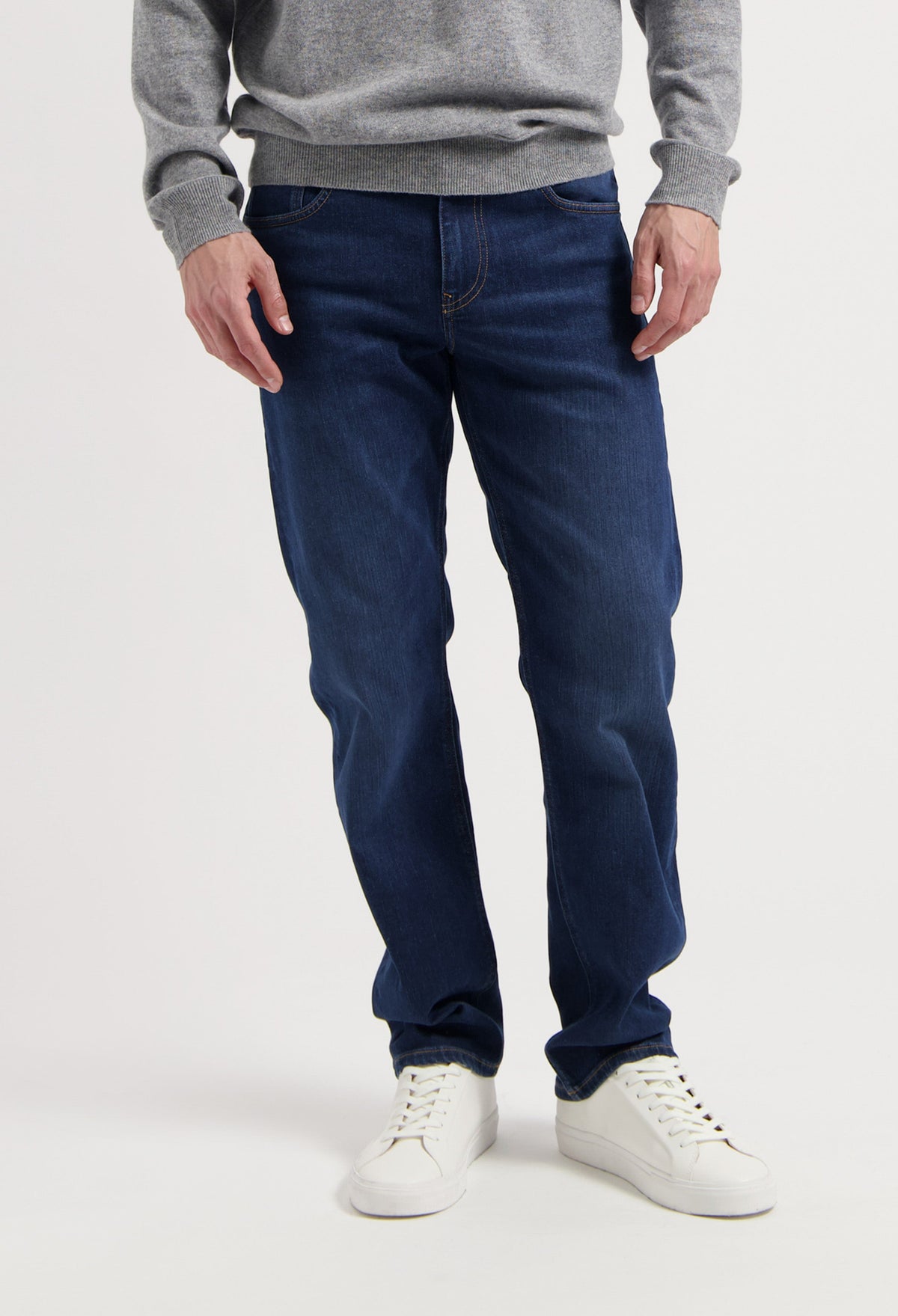 Sustainable MUD Jeans denim jacket in faded blue, featuring ethical organic cotton, worn with matching jeans.