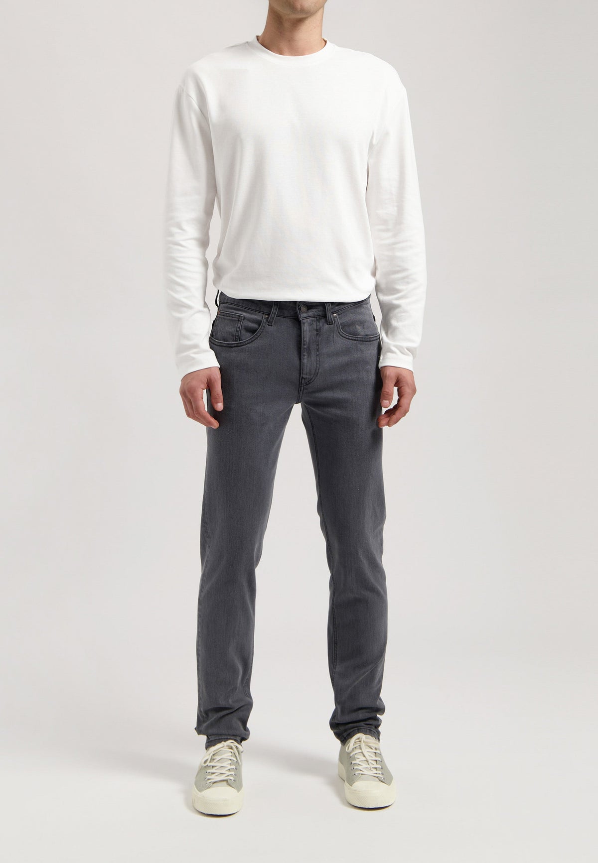 Sustainable MUD Jeans in dark denim, classic fit, showcasing ethical fashion with eco-friendly materials.