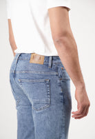 Sustainable MUD Jeans shorts in vivid blue, crafted from organic cotton, offering a modern fit with ethical style.
