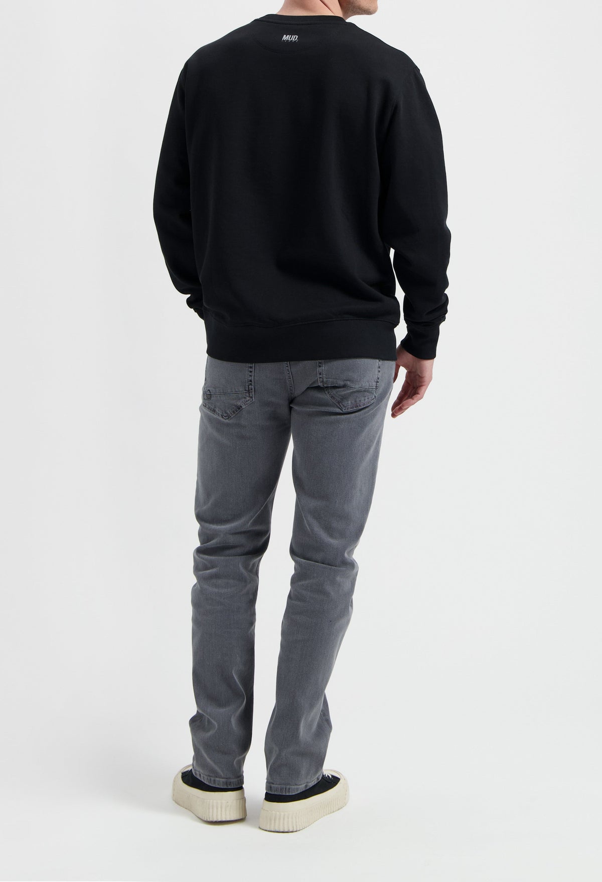 Sustainable MUD Jeans in light blue denim, crafted with organic cotton, showcasing ethical fashion with a classic fit.